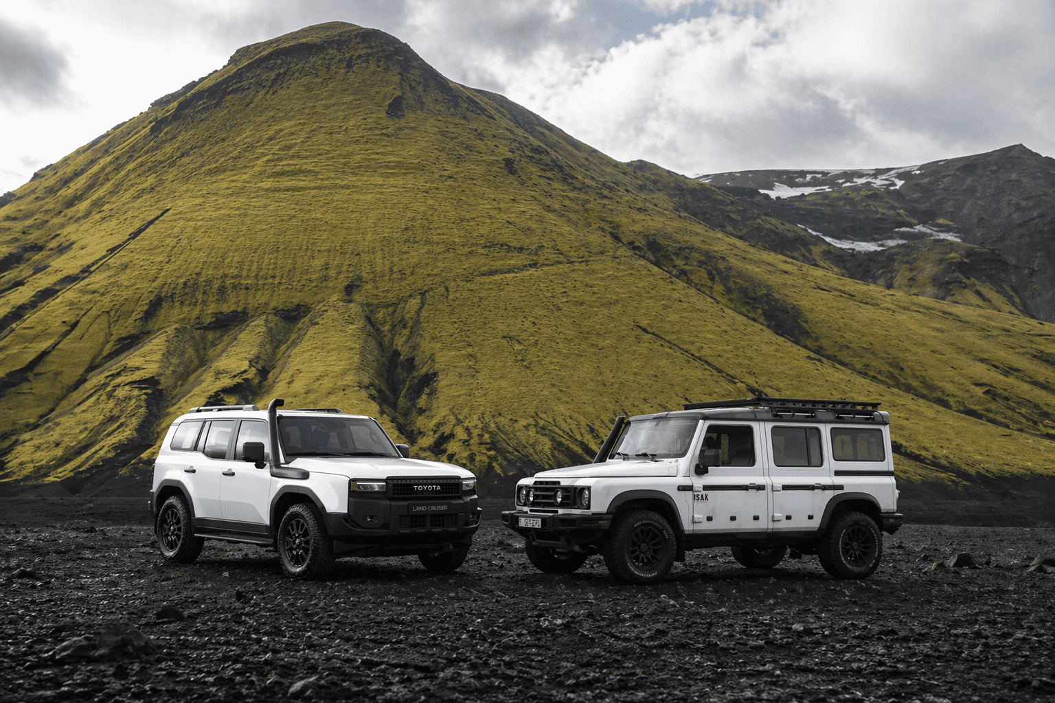 Two expedition cars in Iceland landscape